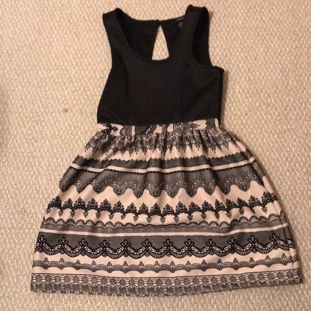 Black dress with tan, flare skirt design